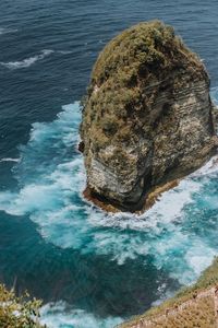 High angle view of rock formation in sea