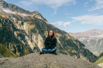 High angle view of woman standing on mountain