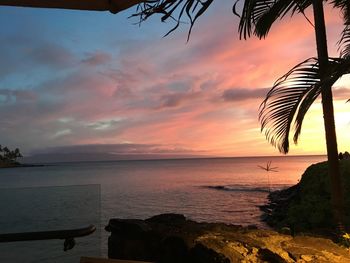 Scenic view of sea against sky at sunset