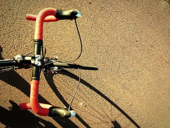 High angle view of bicycle parked against wall