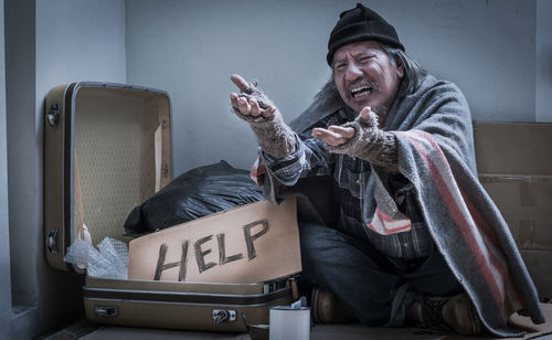 Full length of a man holding camera