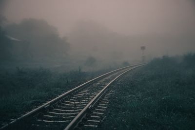 Railroad tracks in foggy weather