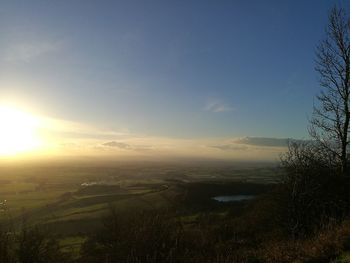 Scenic view of field against sky during sunset
