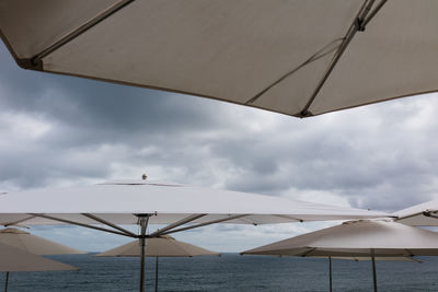 Low angle view of umbrella against sky