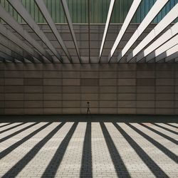 Shadow of man on escalator