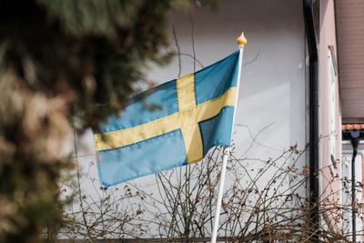 Low angle view of flag against building