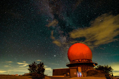 Built structure against sky at night