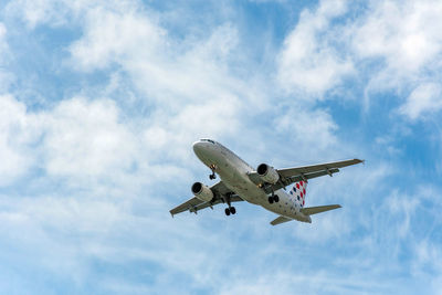 Commercial passenger jet airplane in mid flight, getting ready for landing