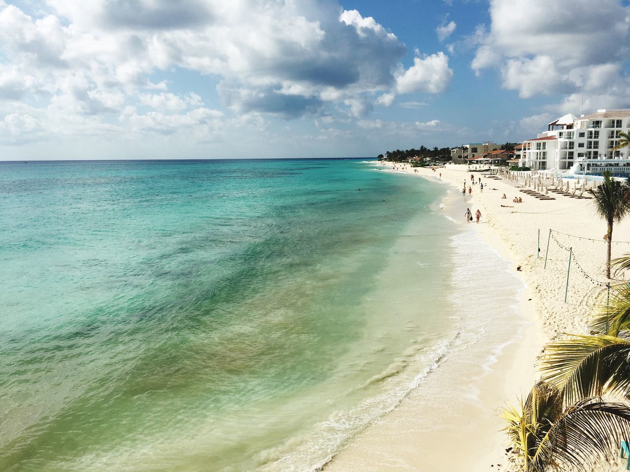 sea, beach, water, sky, horizon over water, beauty in nature, cloud - sky, sand, nature, scenics, day, tranquil scene, tranquility, travel destinations, outdoors, architecture, vacations, no people, building exterior, built structure, wave