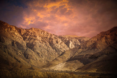 Scenic view of rocky mountains against sky during sunset