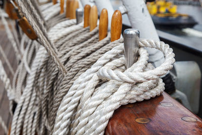 Close-up of rope tied on wooden post