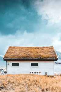 House on field against sky