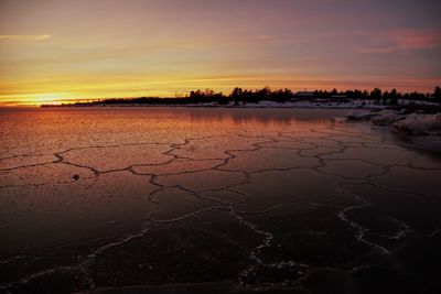 Scenic view of lake against sky during sunset