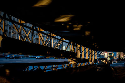 Illuminated bridge in city at night