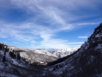 Scenic view of mountains against sky during winter