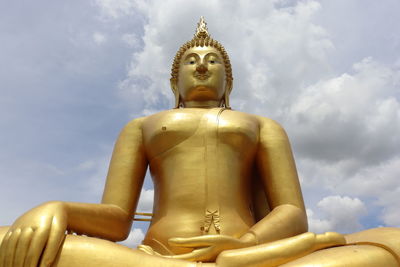 Low angle view of statue against sky