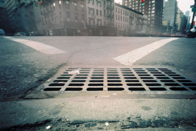 Surface level of road by buildings in city