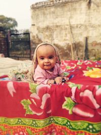 Portrait of cute girl smiling outdoors