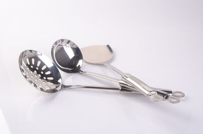 High angle view of spoons on white background