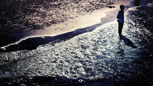 Reflection of woman in water