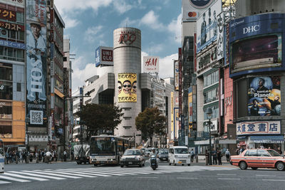 City street and buildings against sky