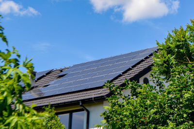 Historic house with modern solar panels on roof