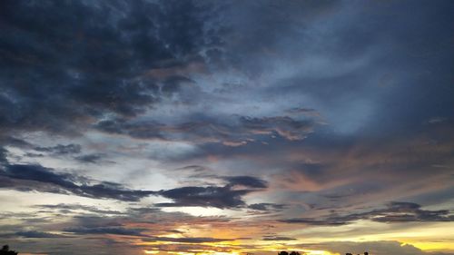 Low angle view of dramatic sky during sunset