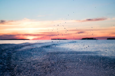 Scenic view of sea at sunset