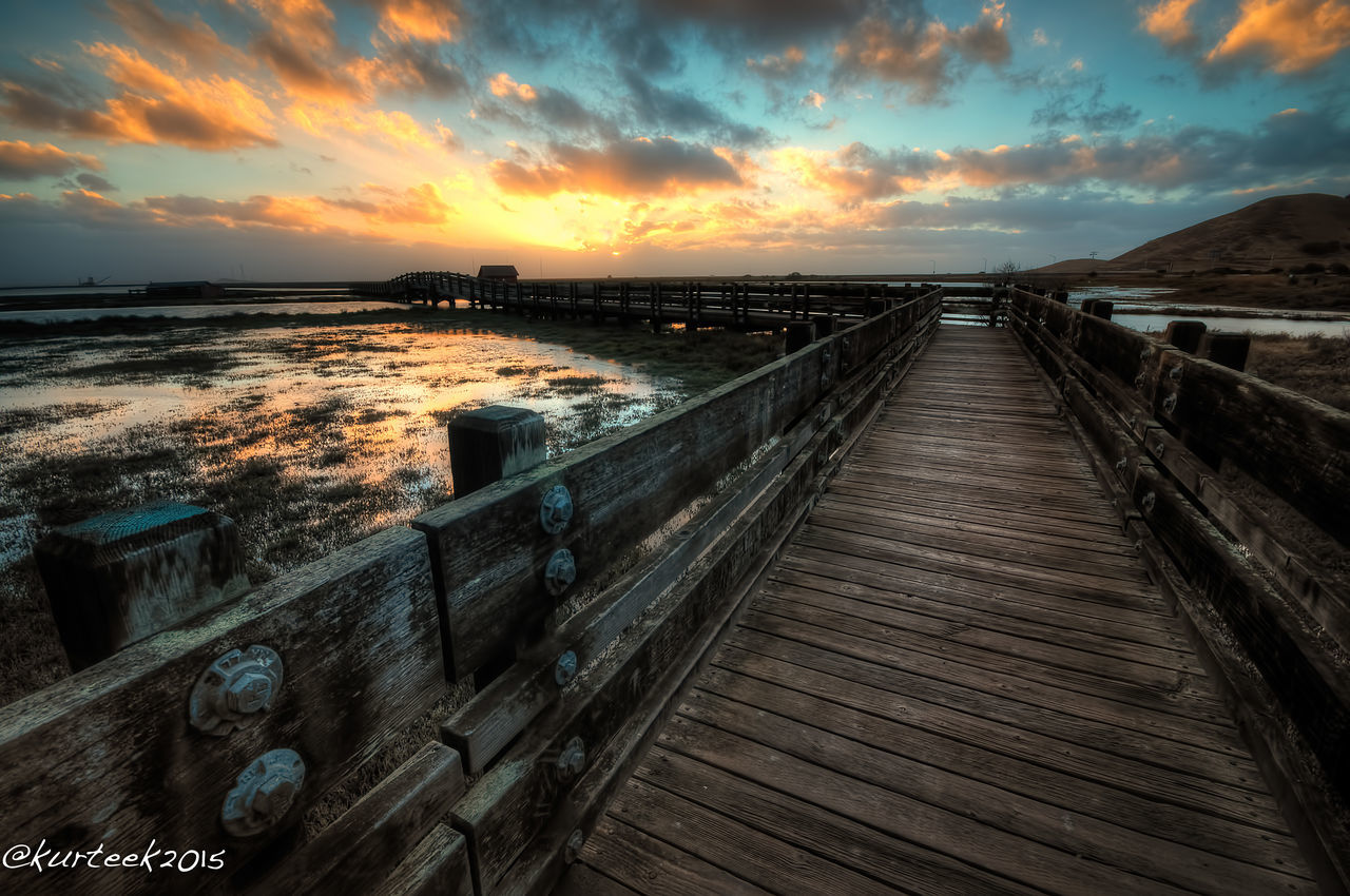 sunset, sky, water, sea, cloud - sky, built structure, the way forward, architecture, horizon over water, cloud, cloudy, scenics, pier, tranquil scene, tranquility, diminishing perspective, nature, beauty in nature, beach, outdoors