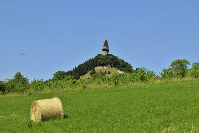 Built structure on field against clear sky