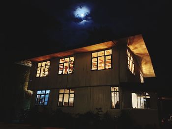 Low angle view of building against sky at night