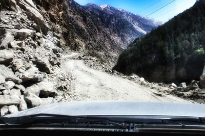 Car on mountain against sky