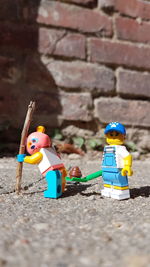 Close-up of toys against wall