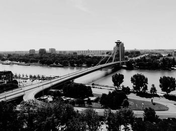 High angle view of bridge over river in city against sky