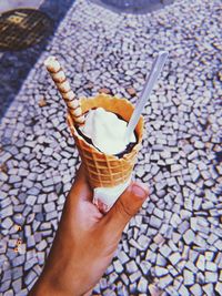 Hand holding ice cream cone