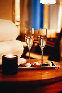 Close-up of wine glasses on table