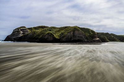 Scenic view of beach against sky