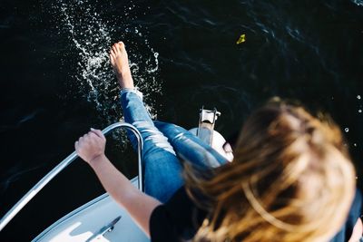 High angle view of woman photographing water