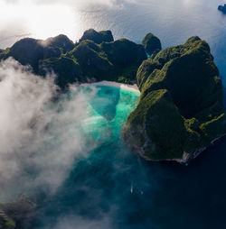 High angle view of rocks in sea