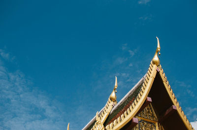 Low angle view of temple building against blue sky