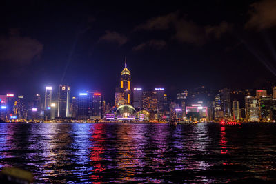 Illuminated city at waterfront