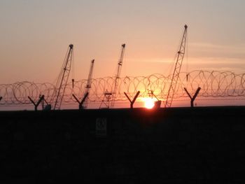 Silhouette of landscape against sky during sunset