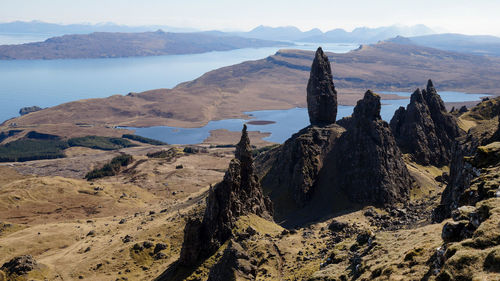 Panoramic view of sea and mountains against sky