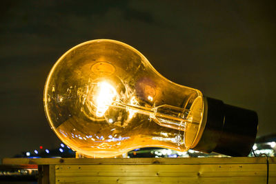 Close-up of illuminated light bulb