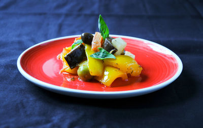 Close-up of fruits in plate on table