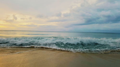 Scenic view of sea against cloudy sky