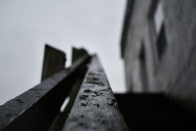 Close-up of wood against sky