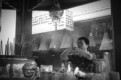 Woman standing in front of store