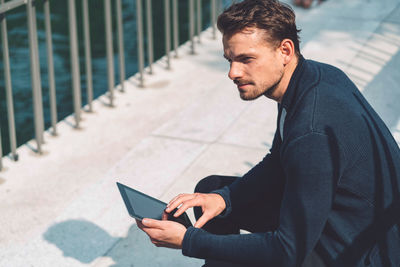 Young man using mobile phone