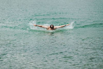 Man swimming in sea